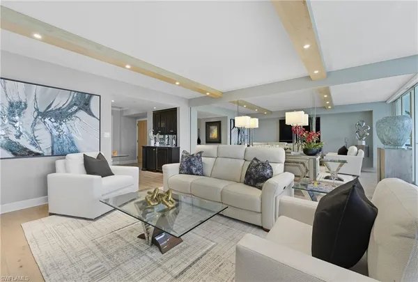 a living room with furniture or couch and a table