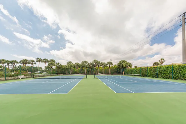 a view of an outdoor space and tennis court