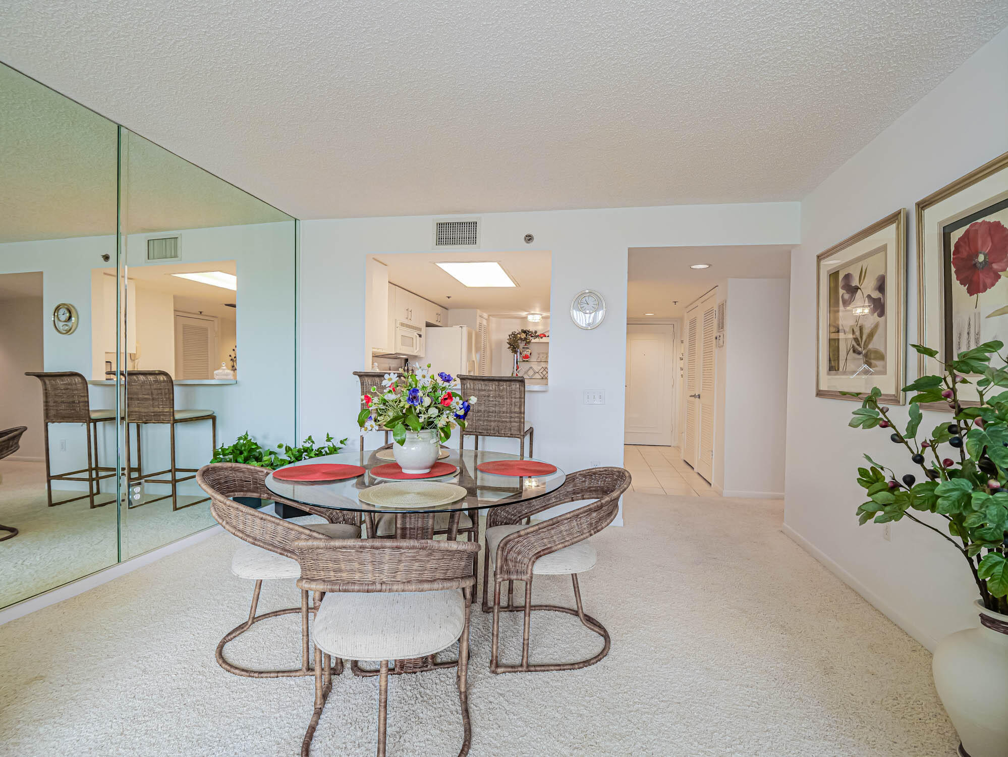 2700 North Hwy A1A, Unit 307 Hutchinson Island, FL 34949 - Photo 34 of 51 a view of a dining room with furniture and wooden floor
