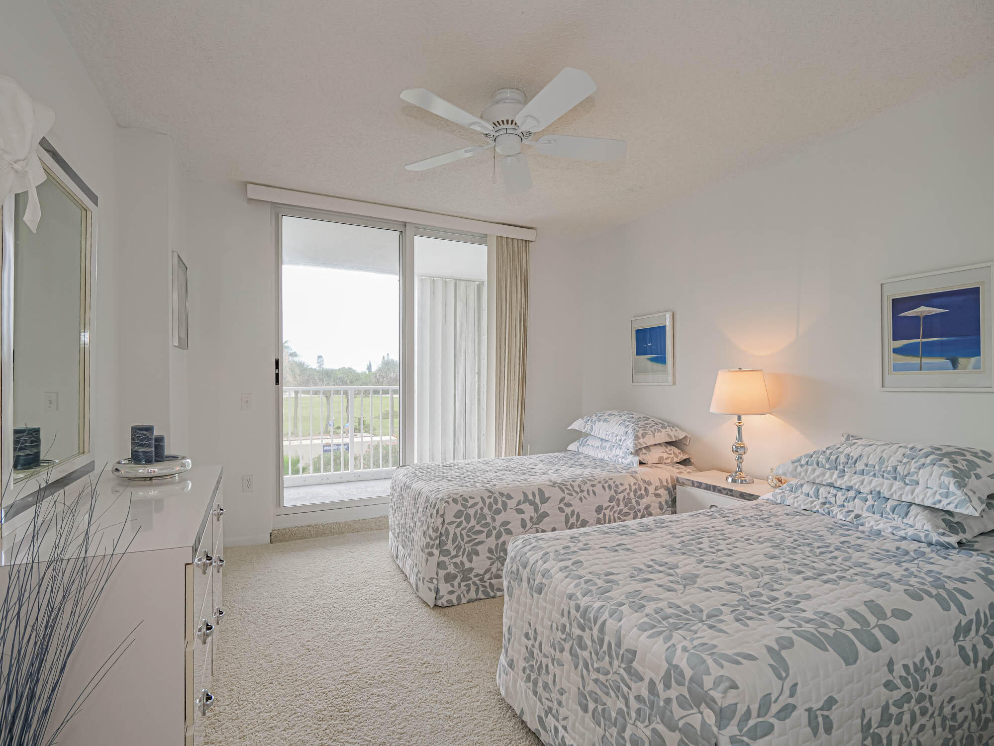 2700 North Hwy A1A, Unit 307 Hutchinson Island, FL 34949 - Photo 42 of 51 a bedroom with a bed and a large window