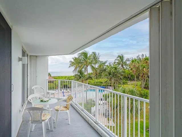 a view of a chairs and table in patio