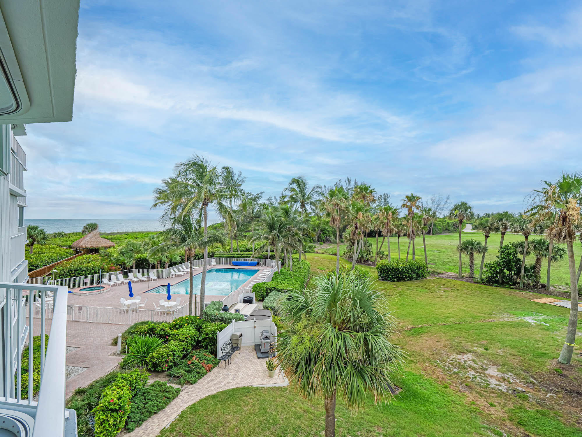 2700 North Hwy A1A, Unit 307 Hutchinson Island, FL 34949 - Photo 49 of 51 a view of a garden with a building in the background