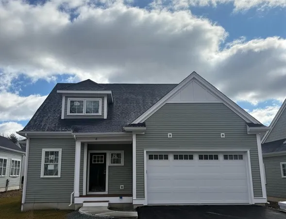 a front view of a house with a garage