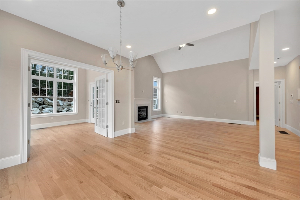 4 Weber Farm Road, Unit 4 Wrentham, MA 02093 - Photo 12 of 17 a view of an empty room with wooden floor and a window