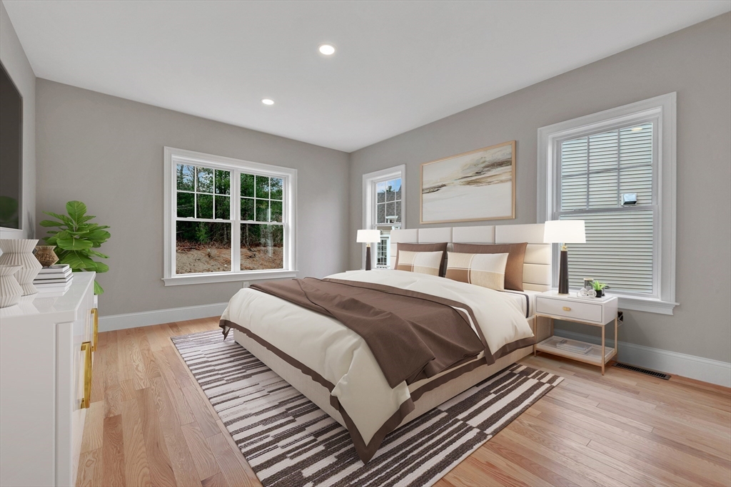 4 Weber Farm Road, Unit 4 Wrentham, MA 02093 - Photo 13 of 17 a bedroom with bed and wooden floor