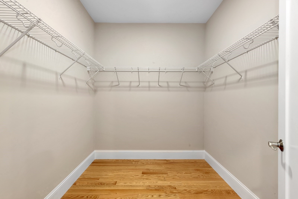 4 Weber Farm Road, Unit 4 Wrentham, MA 02093 - Photo 14 of 17 a view of a room with racks on the wall