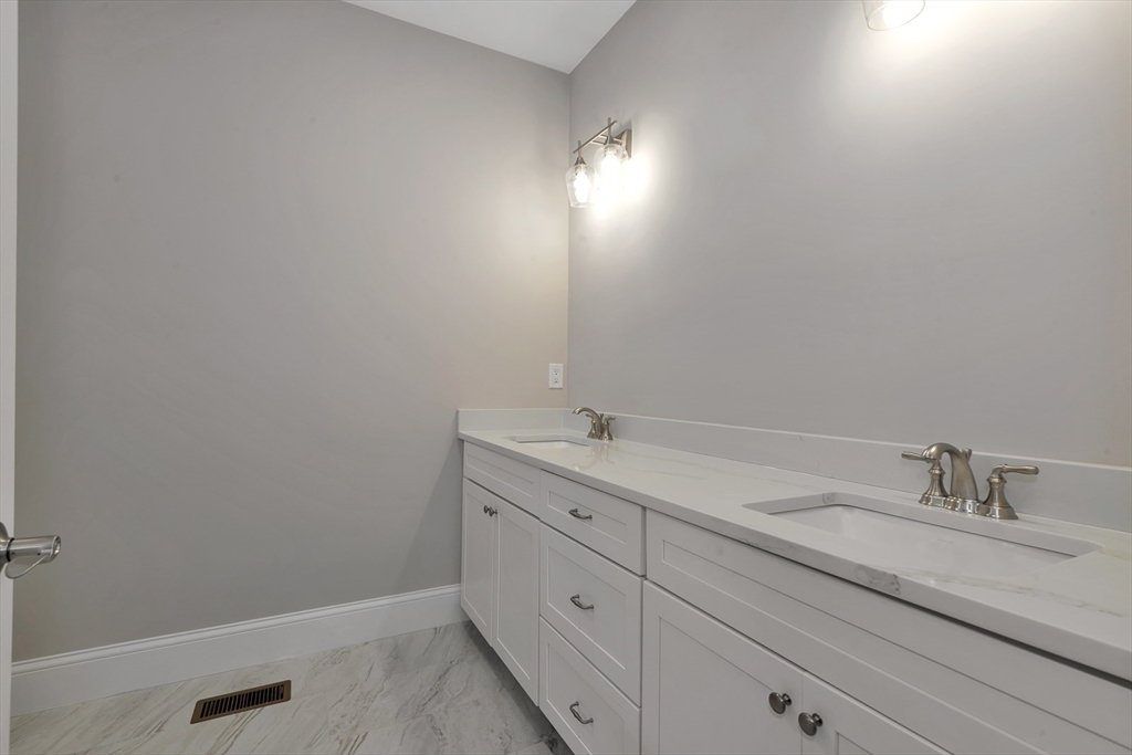 4 Weber Farm Road, Unit 4 Wrentham, MA 02093 - Photo 15 of 17 a bathroom with a sink and vanity