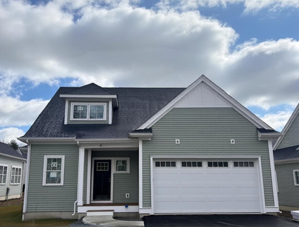 4 Weber Farm Road, Unit 4 Wrentham, MA 02093 - Photo 16 of 17 a front view of a house with a garage