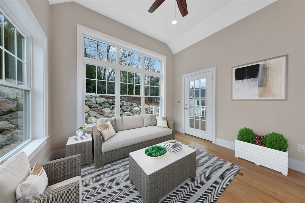4 Weber Farm Road, Unit 4 Wrentham, MA 02093 - Photo 8 of 17 a living room with furniture and a large window