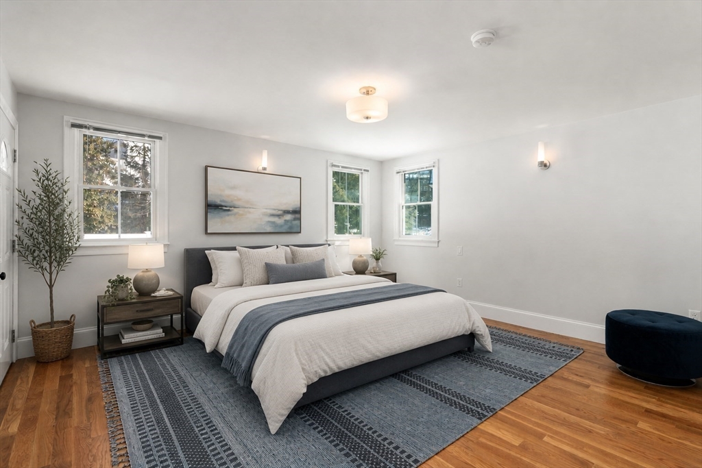 150 Country Club Road Newton, MA 02459 - Photo 12 of 33 a bedroom with a bed and a couch