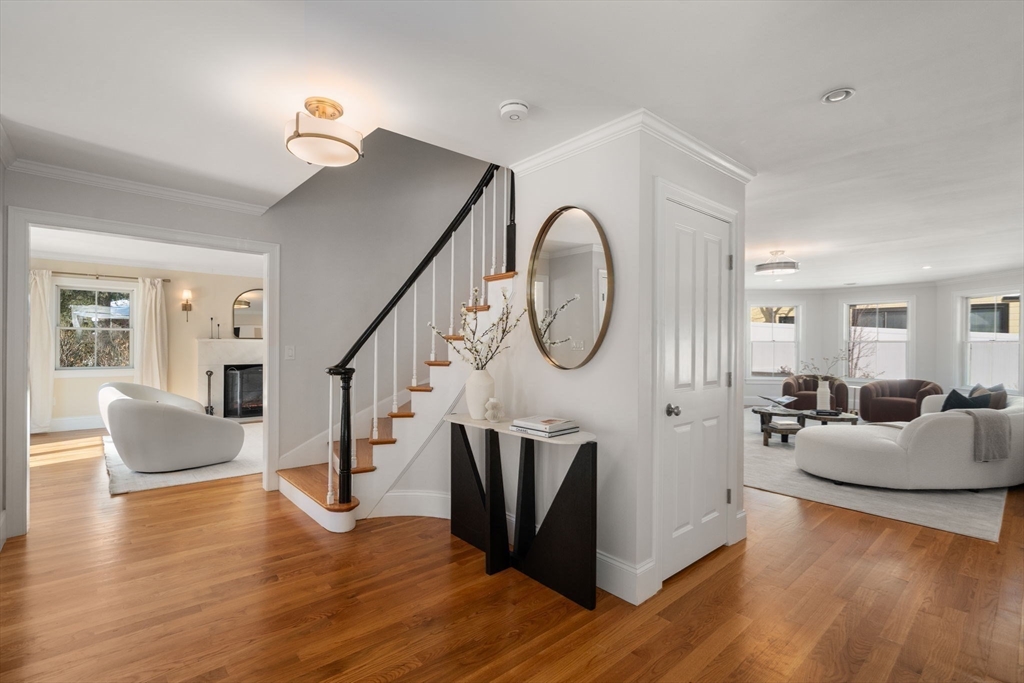150 Country Club Road Newton, MA 02459 - Photo 15 of 33 a living room with furniture mirror and wooden floor