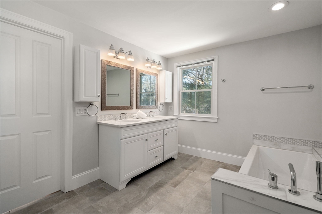 150 Country Club Road Newton, MA 02459 - Photo 20 of 33 a bathroom with a sink vanity and mirror