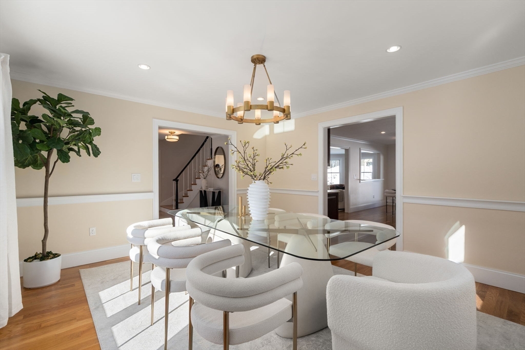 150 Country Club Road Newton, MA 02459 - Photo 10 of 33 a dining room with chandelier and wooden floor