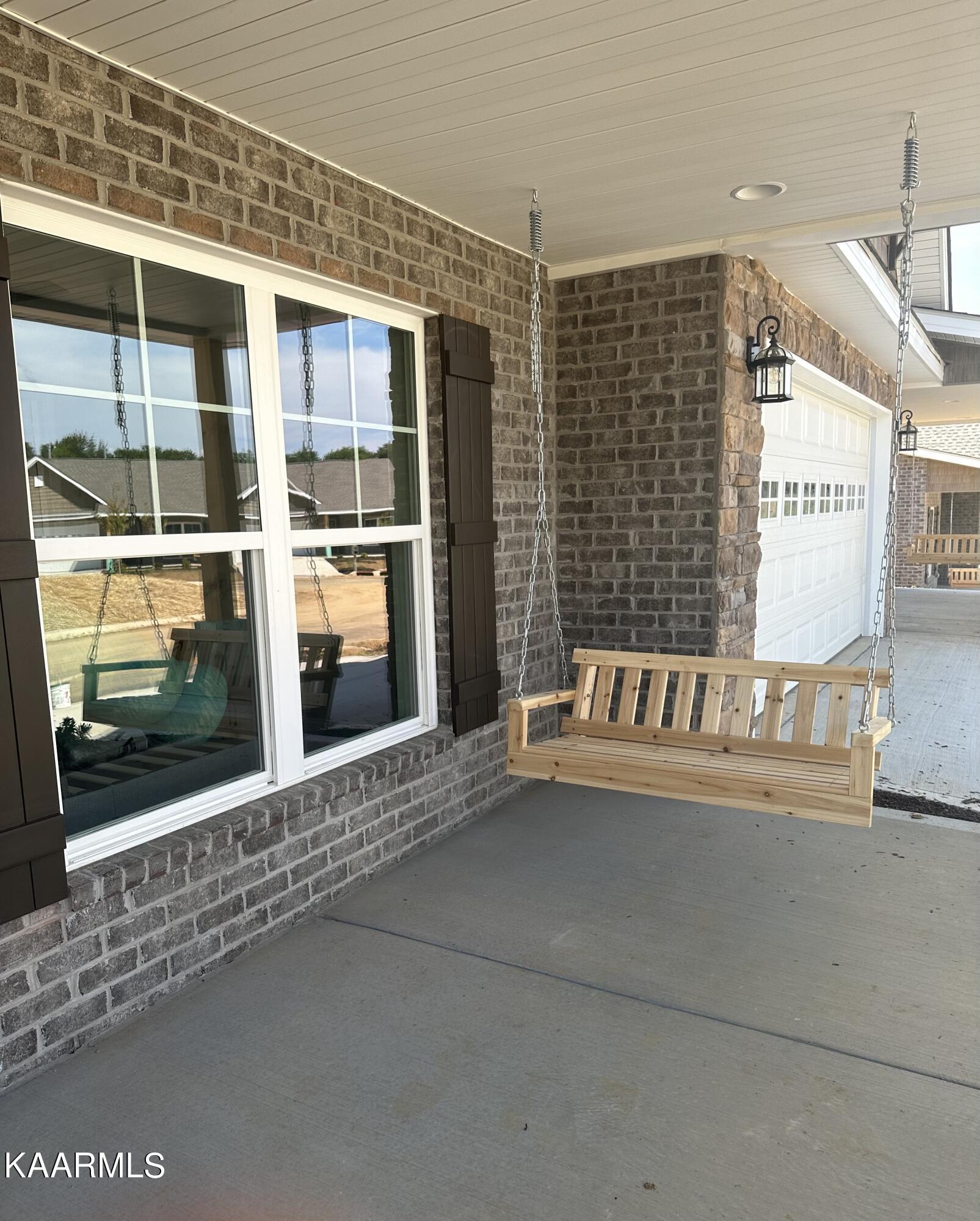 540 Henderson Road, Unit 14 Pigeon Forge, TN 37862 - Photo 33 of 40 Front Porch Swing