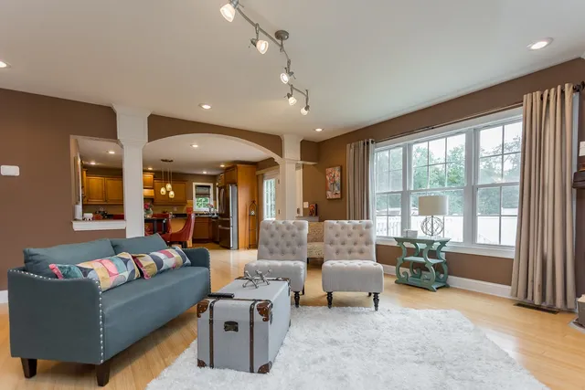 a kitchen with stainless steel appliances granite countertop a sink refrigerator and cabinets