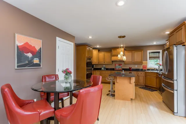 a view of a dining room with furniture window and outside view
