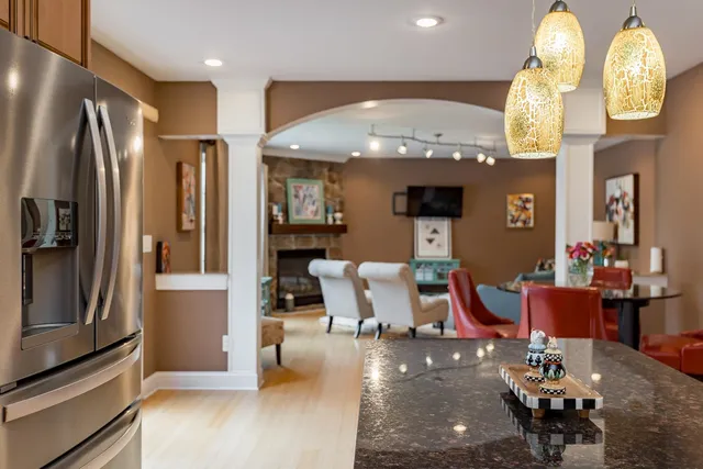 a view of a dining room with furniture and wooden floor