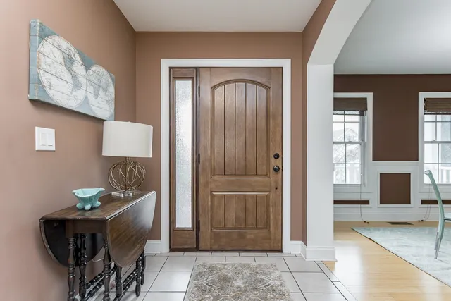 a bedroom with a bed and a table