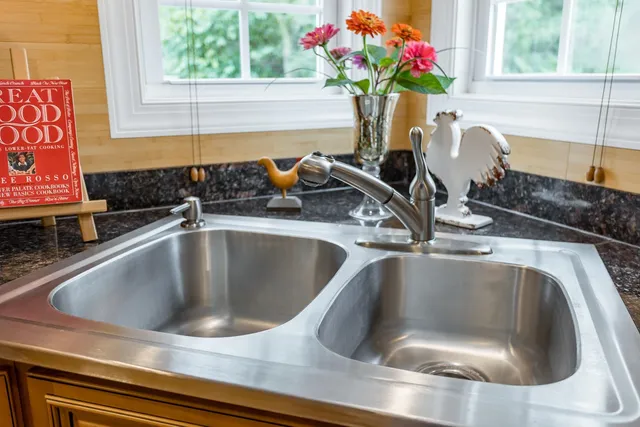 a bathroom with a bathtub sink and mirror