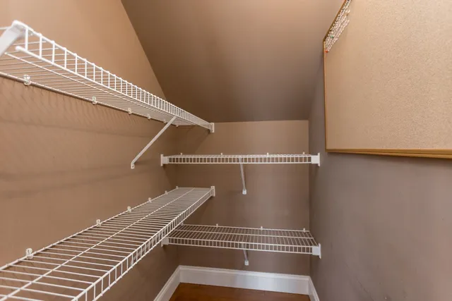 a bedroom with bed and window