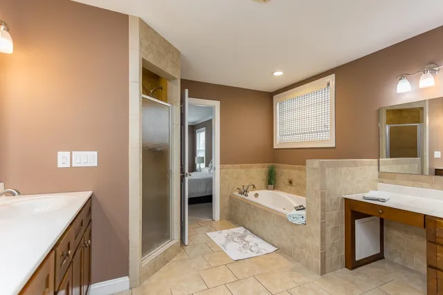 a view of hallway with stairs and wooden floor