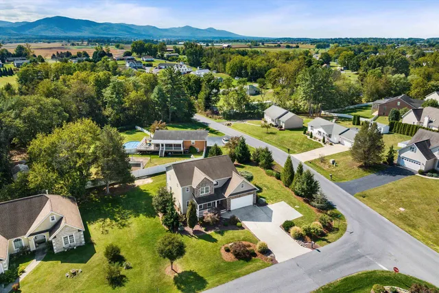 an aerial view of a house with a ocean view