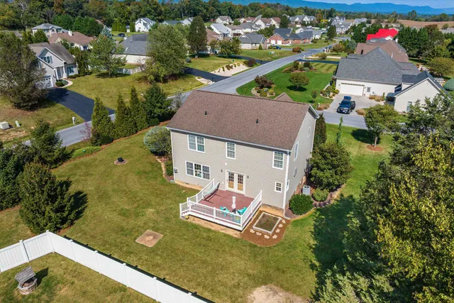 a front view of a house with outdoor seating