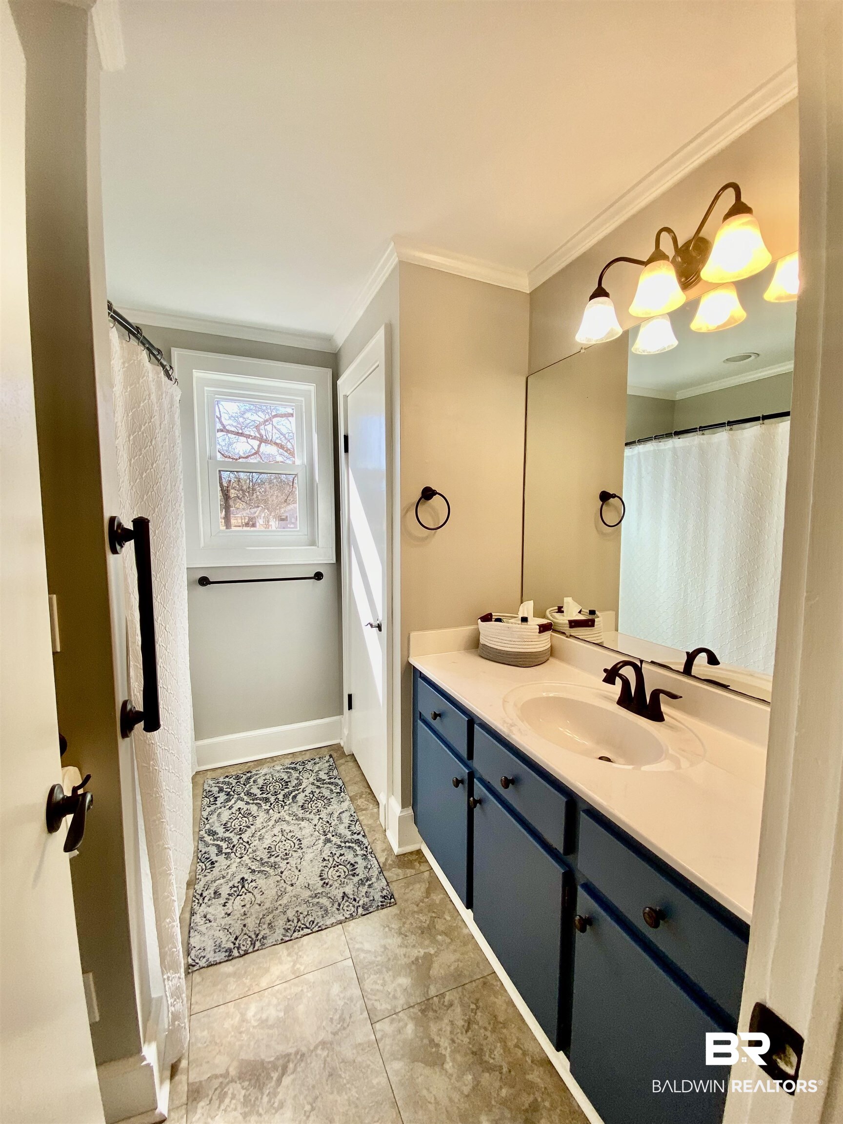 2711 County Road 5 Repton, AL 36475 - Photo 17 of 36 Bathroom featuring vanity, tile patterned flooring, and crown molding