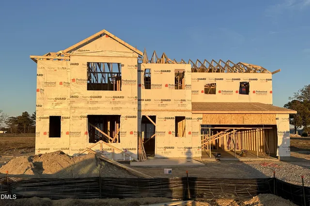 a front view of a house with garage