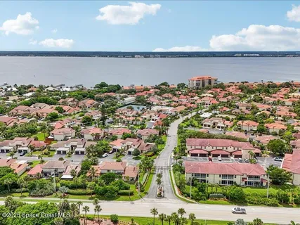 an aerial view of a house with a lake view