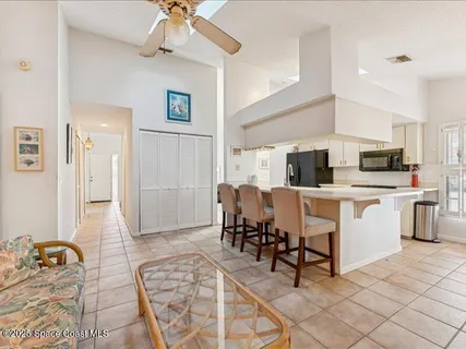 a work room with furniture and view kitchen