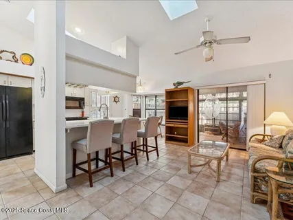 a view of a livingroom with furniture and a flat screen tv