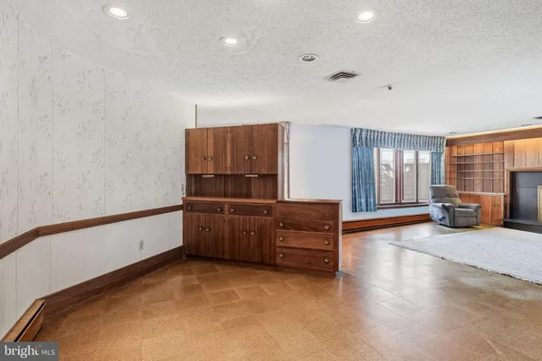 a kitchen with a refrigerator sink and stove top oven