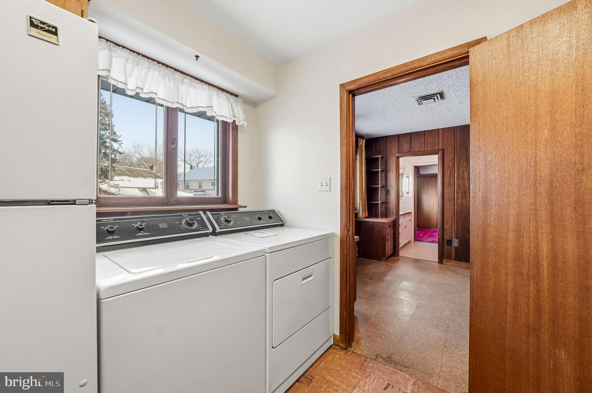 23 Lake Street Bridgeton, NJ 08302 - Photo 29 of 58 a view of a hallway with washer and dryer