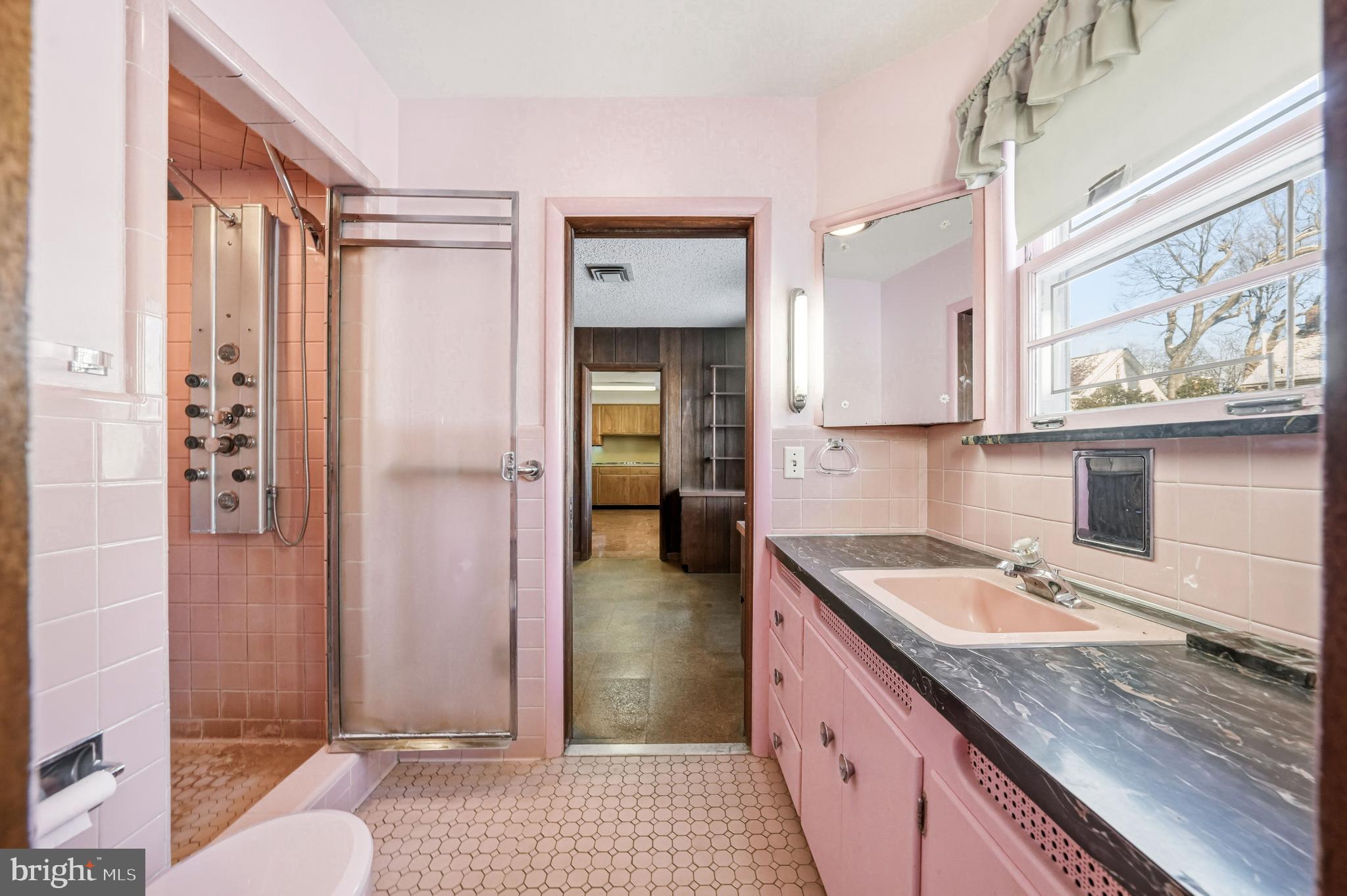 23 Lake Street Bridgeton, NJ 08302 - Photo 39 of 58 a bathroom with a granite countertop sink and a mirror