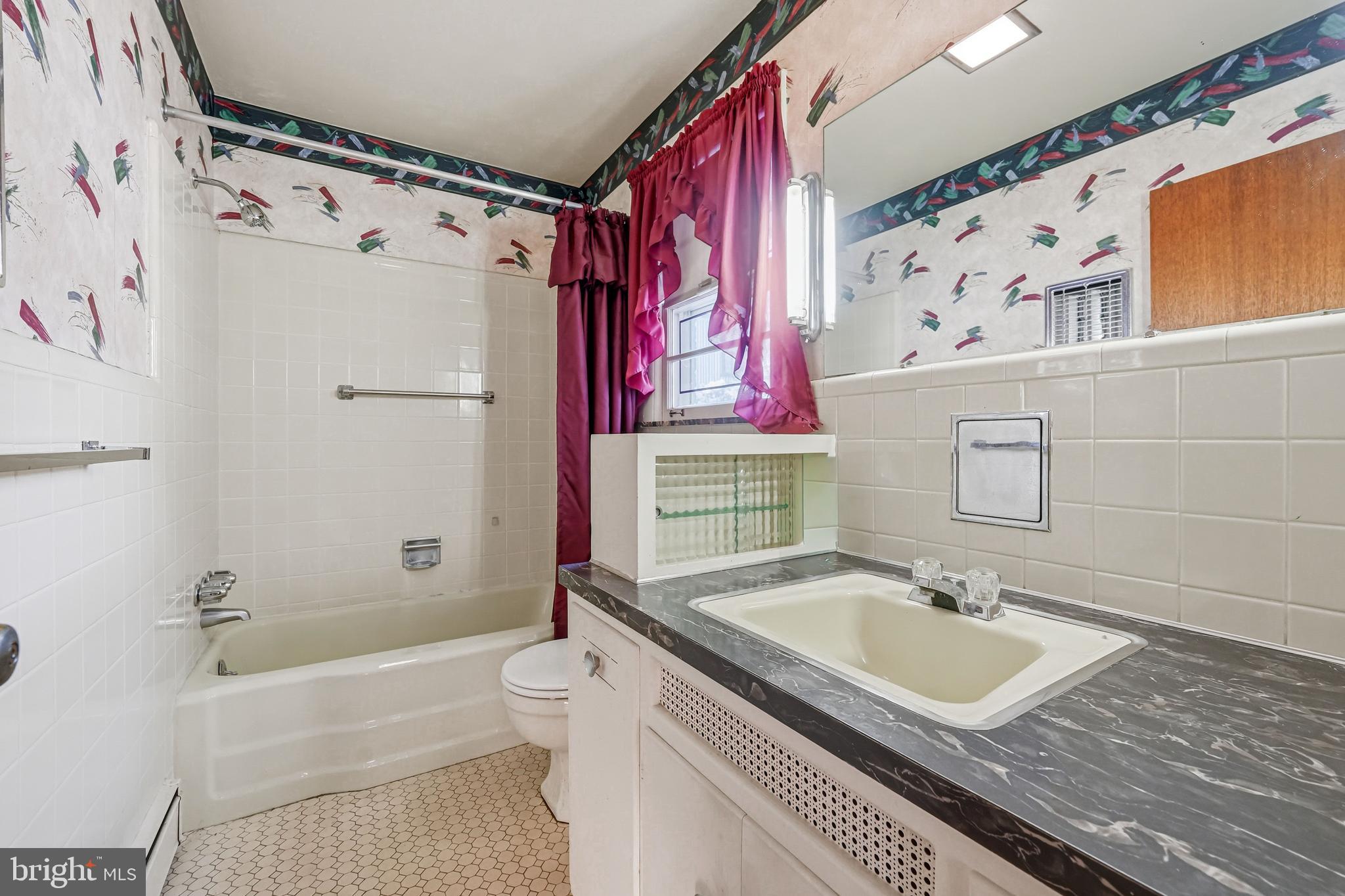 23 Lake Street Bridgeton, NJ 08302 - Photo 41 of 58 a bathroom with a sink toilet and shower