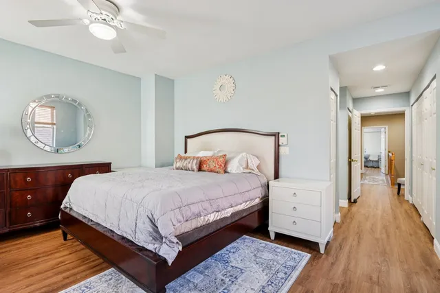 a bedroom with a bed and a mirror