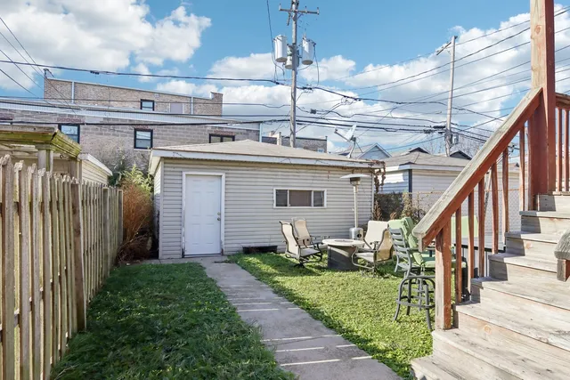 a patio with table and chairs
