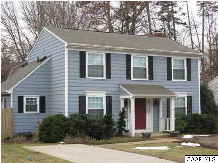 a front view of a house with yard