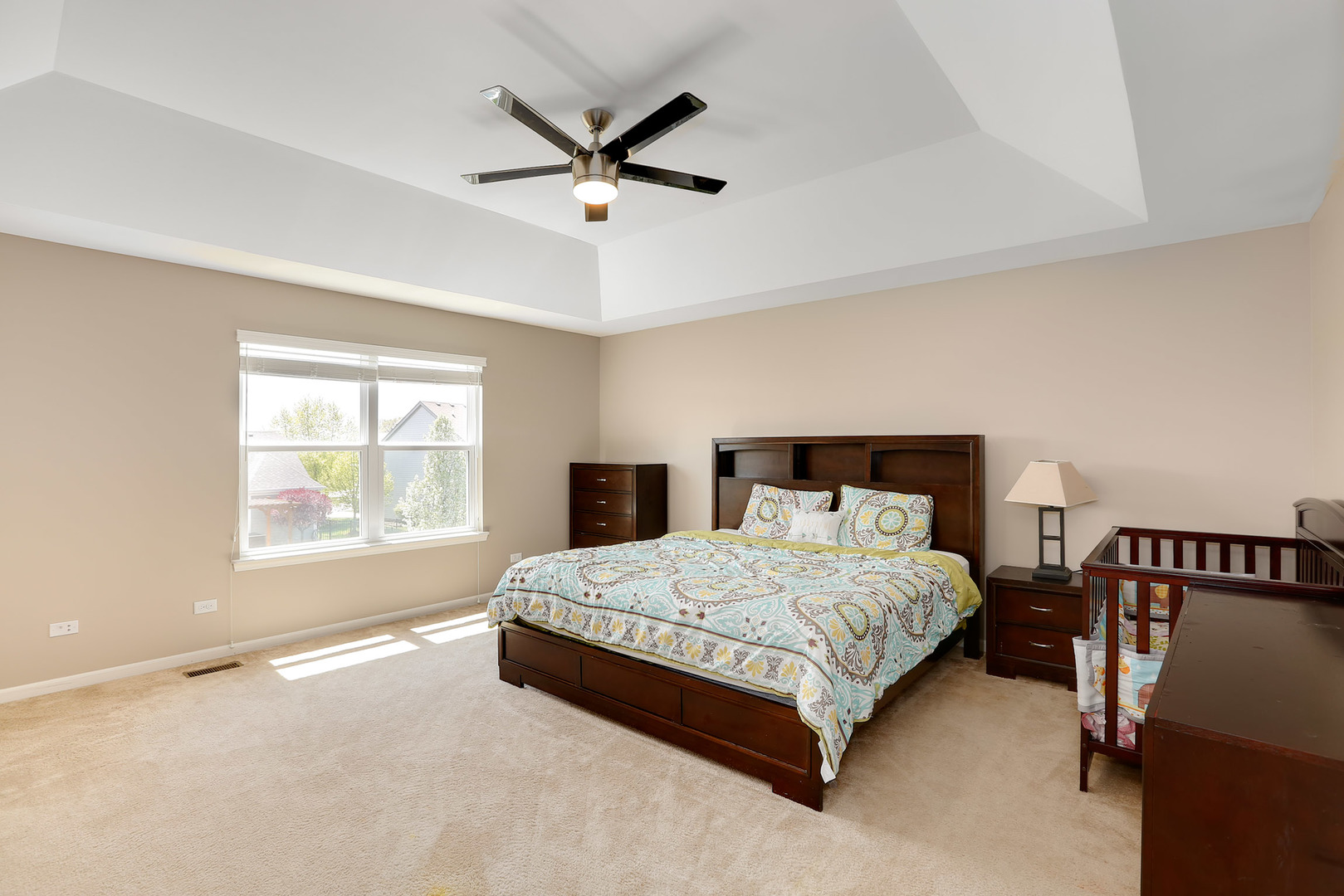 3531 English Prairie Road Elgin, IL 60124 - Photo 18 of 34 a bedroom with a bed a chandelier and a window