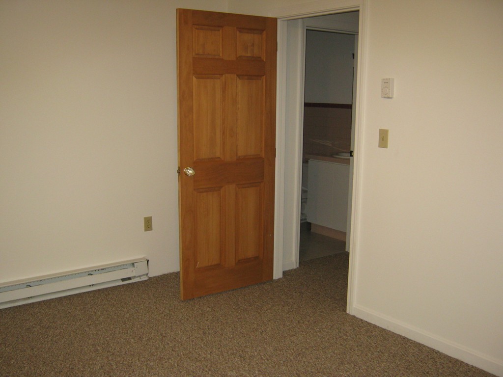 65 Victoria Heights Road, Unit 65 Boston, MA 02136 - Photo 14 of 16 an empty room with closet area