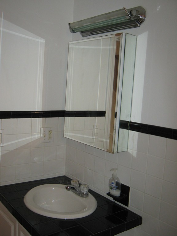 65 Victoria Heights Road, Unit 65 Boston, MA 02136 - Photo 5 of 16 a bathroom with a sink and a mirror