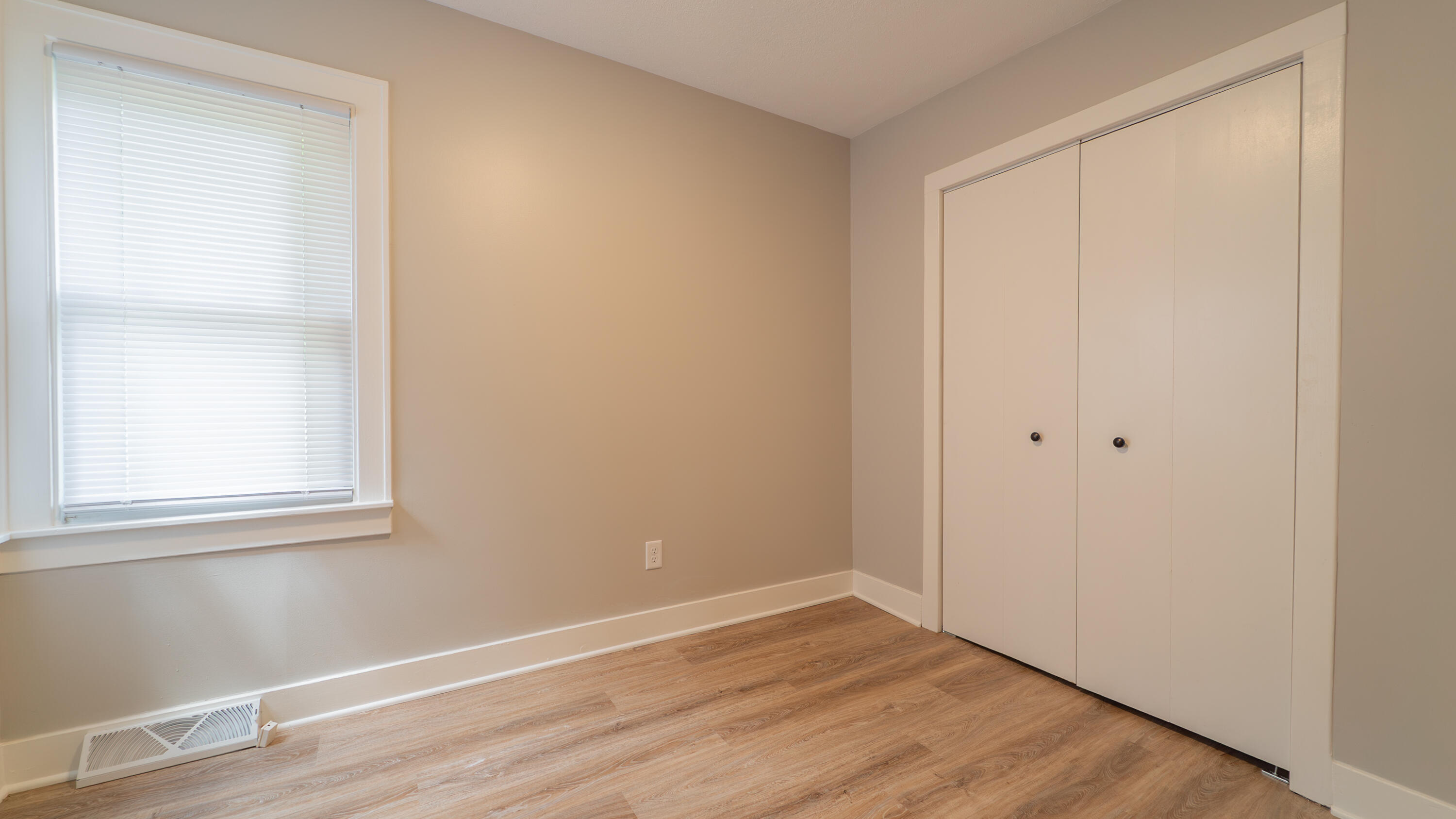 2459 South St Road Valparaiso, IN 46385 - Photo 15 of 24 a view of an empty room with wooden floor and a window