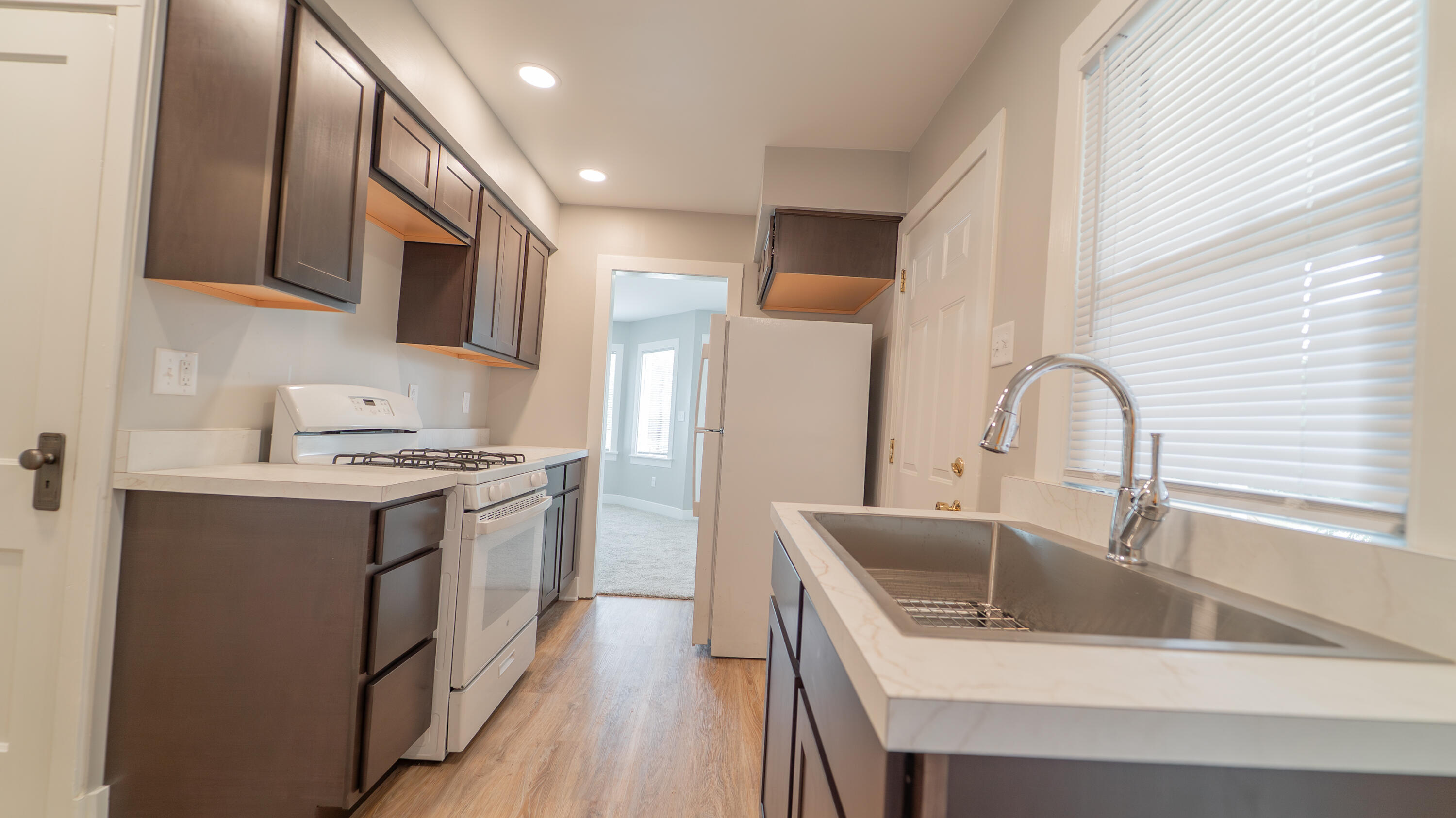 2459 South St Road Valparaiso, IN 46385 - Photo 6 of 24 a kitchen with stainless steel appliances granite countertop a sink stove and refrigerator