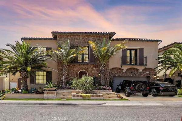 a front view of a house with garage