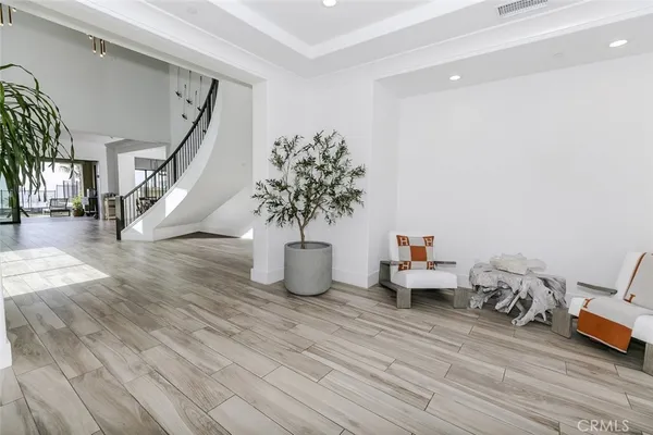 a bedroom with furniture and a flat screen tv