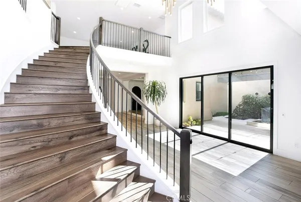 a lobby with furniture and floor to ceiling window