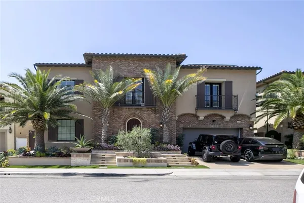 a front view of house with yard and outdoor seating