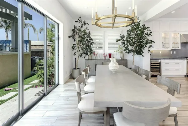 a kitchen with stainless steel appliances granite countertop a lot of counter space and wooden floors