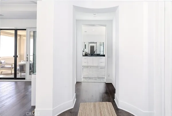 a bathroom with a granite countertop sink toilet a mirror a vanity and shower